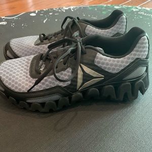 Men’s size 8 Reebok Zigtech shoes.